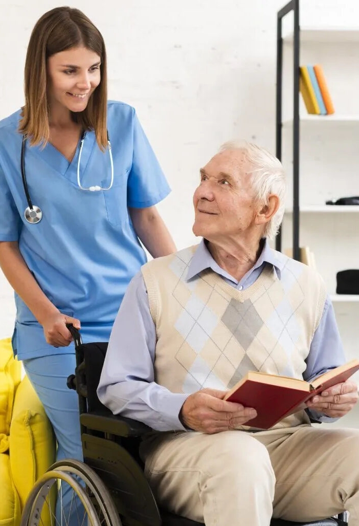 old-man-sitting-wheelchair-while-talking-nurse-min-1536x1025